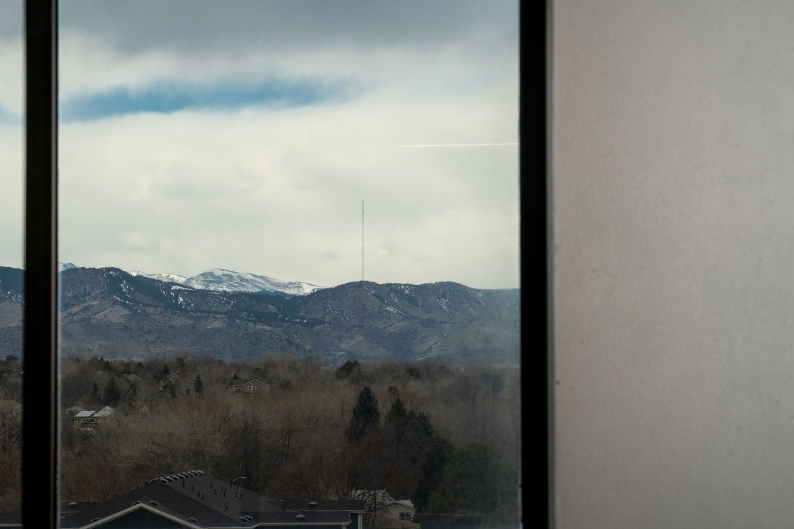 Window framing the foothills west of Denver
