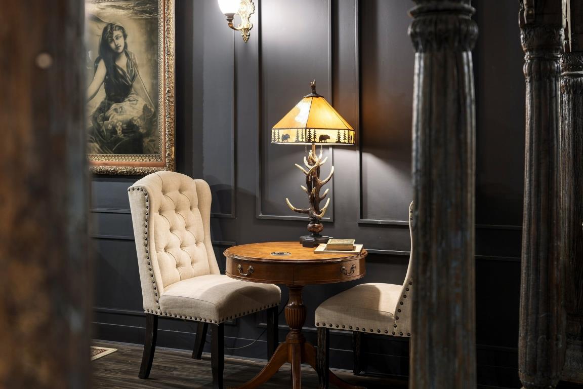 Two chairs and side table in an intimate shared room