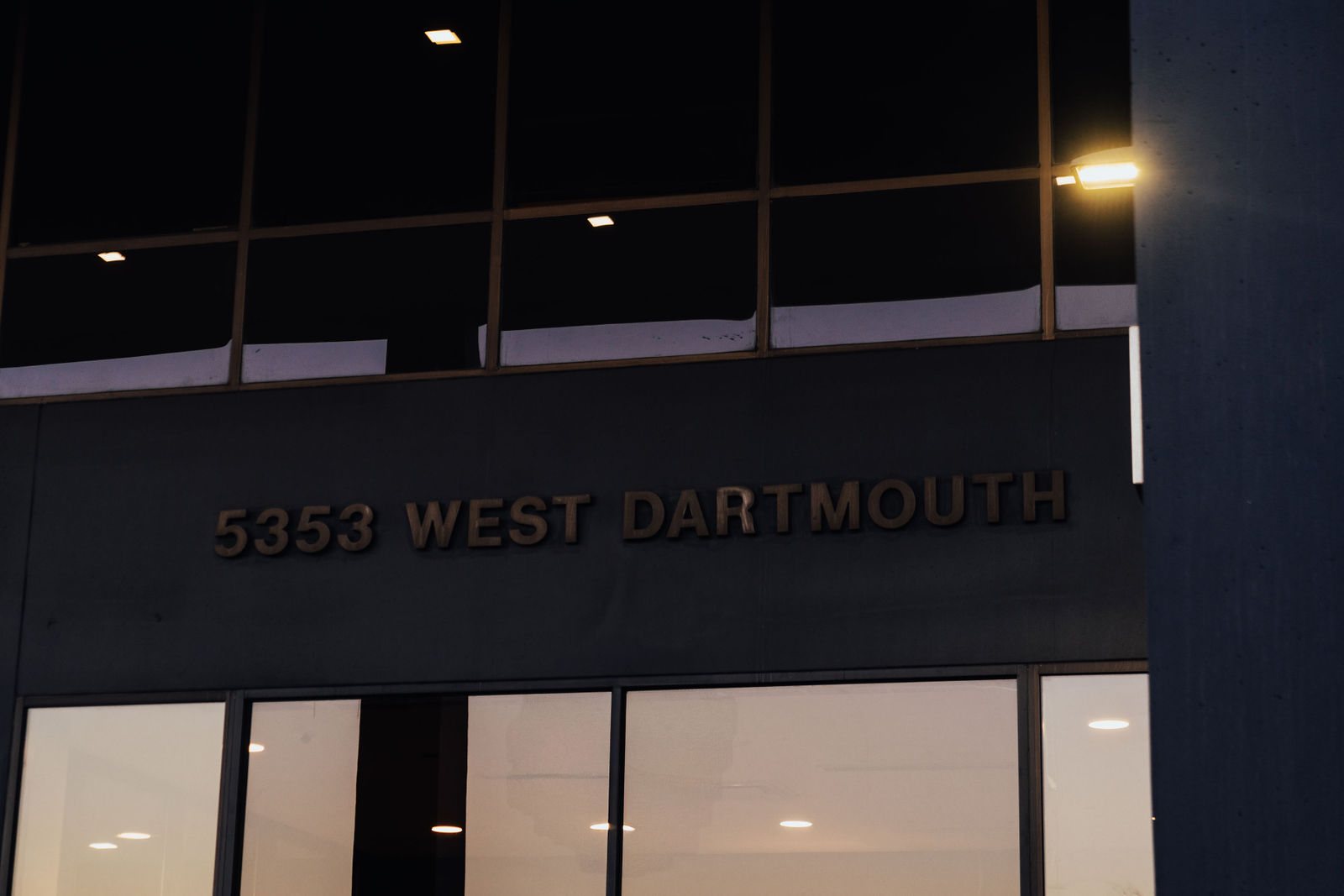 Building address signage above the entry