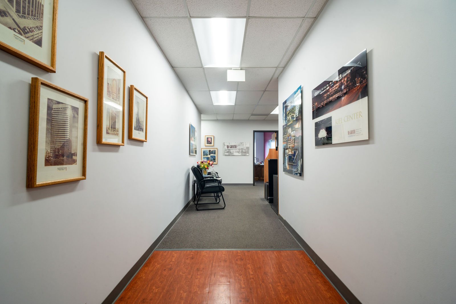 Corridor hung with framed artwork