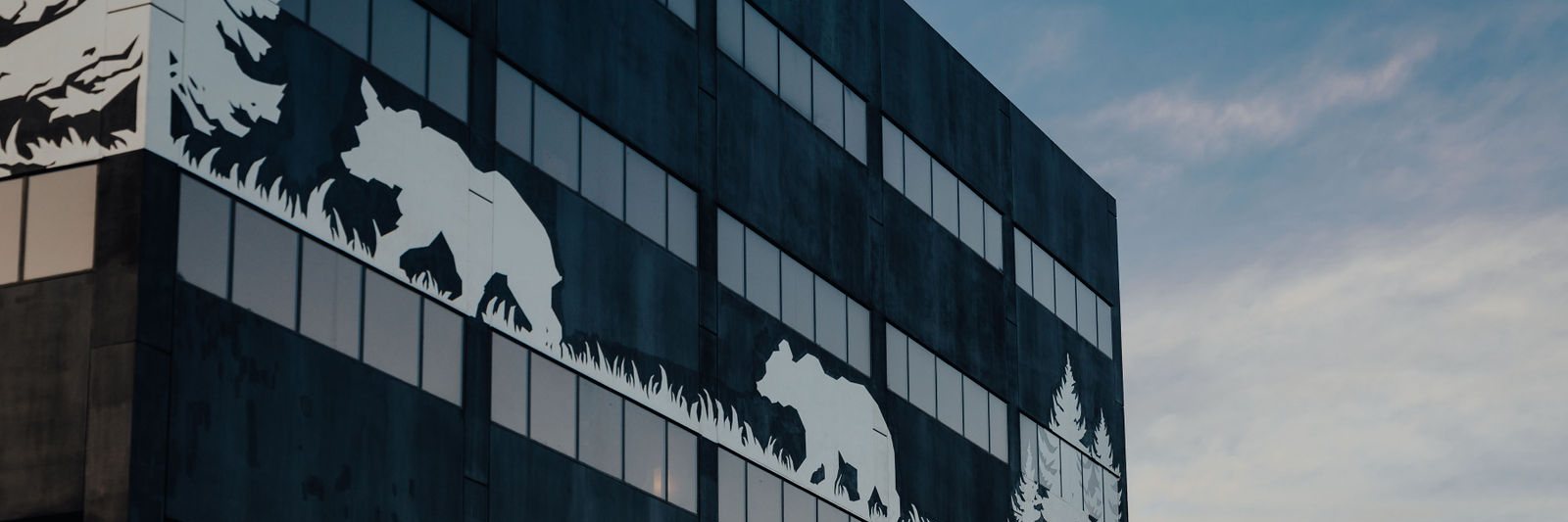 Close view of the bear mural across the glazing